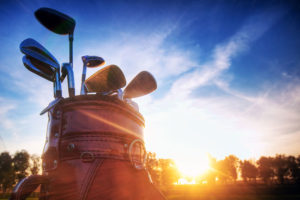 Professional golf gear on the golf course at sunset