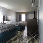 guest room with two queen beds
